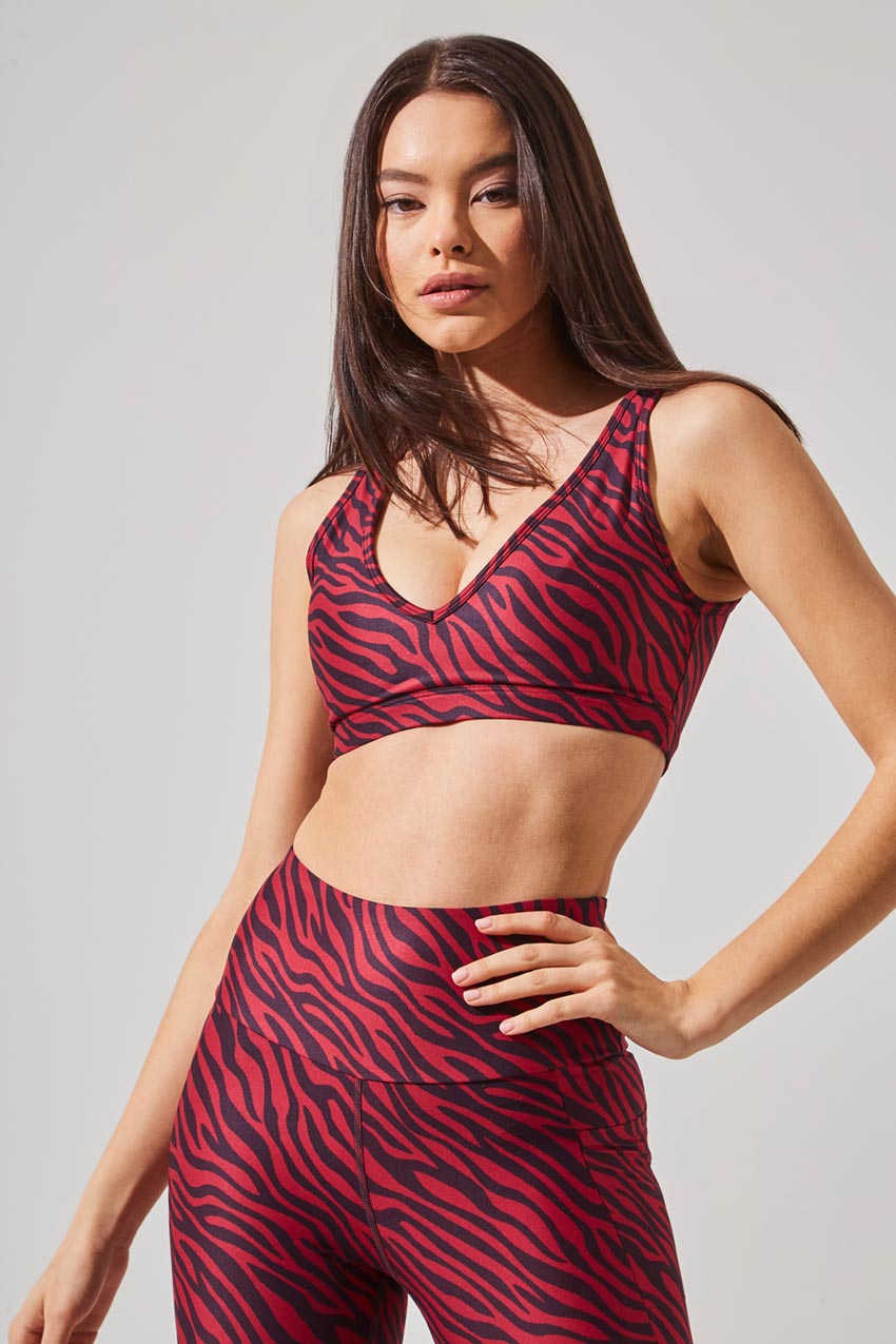 MPG Sport women's Soar Recycled Polyester Zebra Print Light Support Bra in Zebra Plum/Rumba Red