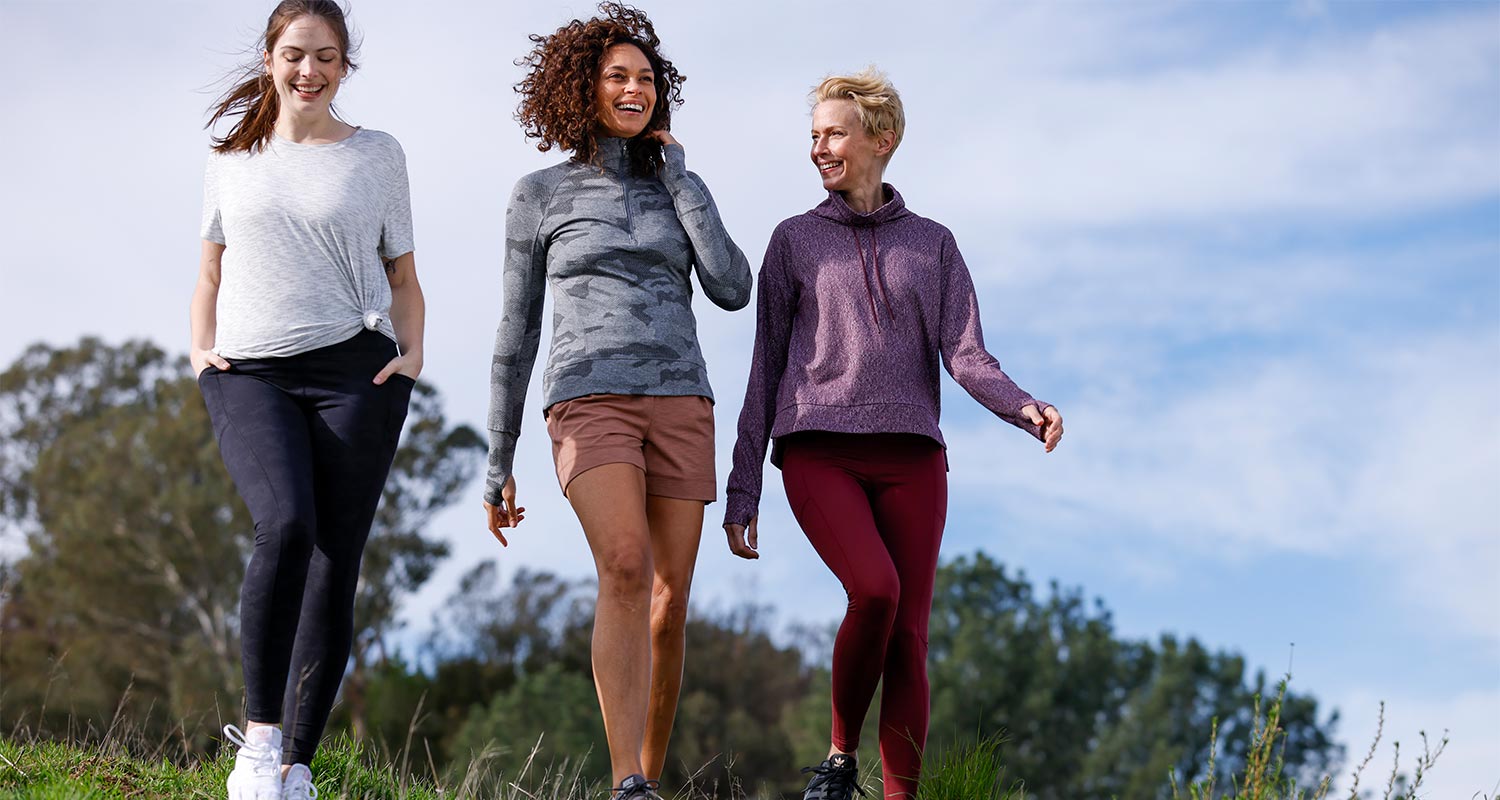 Three Mondetta female models walking down a hill, wearing Mondetta activewear