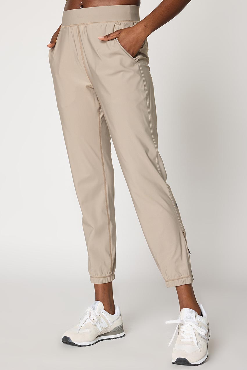 MPG Sport Adapt Back Leg Zip Jogger 27"  in New Taupe